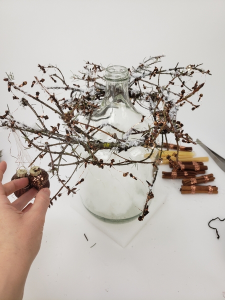 Drape the copper wire clover garland all over the twig wreath