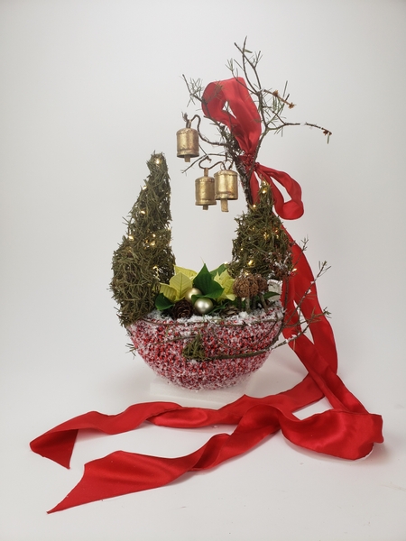 Hanging bells in a Christmas design to match a pinecone reindeer
