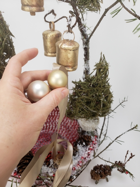 I am using a champagne coloured ribbon and baubles to dress the pots