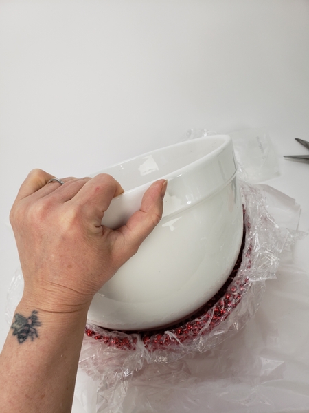 Lift your container out of the bead bowl but leave the plastic wrap