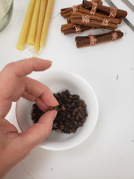 Pour a bag of cloves into a tiny bowl