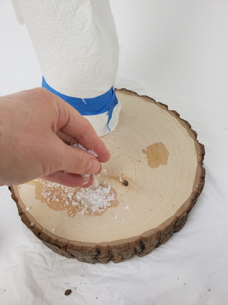 Sprinkle the log with artificial snow