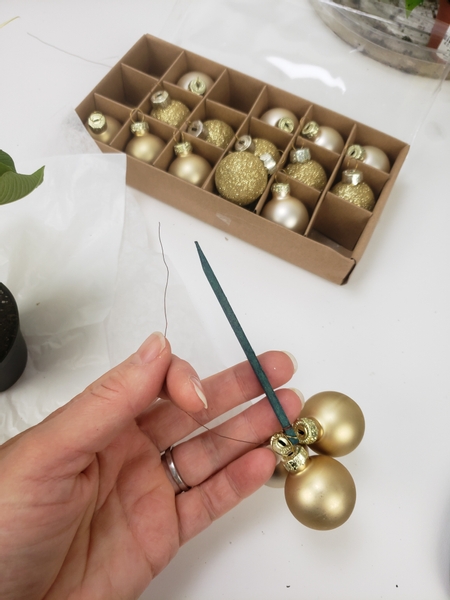 Thread three baubles into a wired wood pick