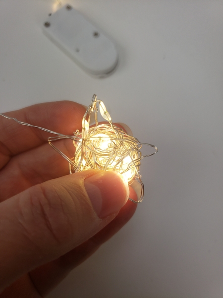 Wrap the leftover wire around the star shape to secure it