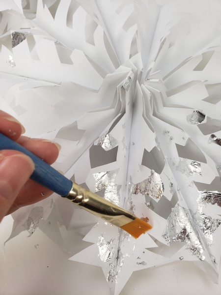 Brush the extra bits of silver leaf away with a soft brush