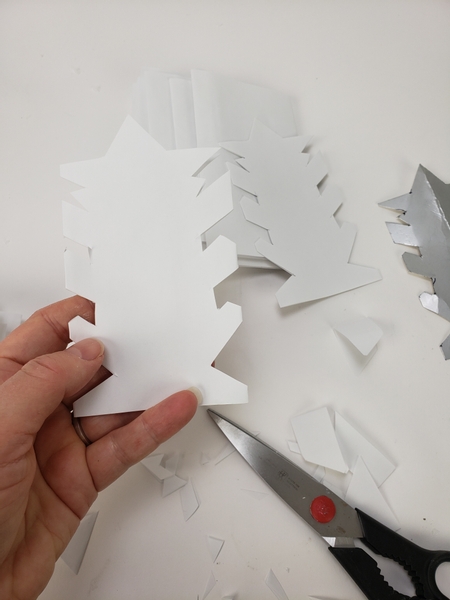 Next we use the template to cut the paper shapes