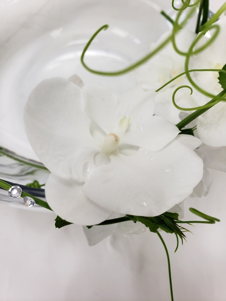 Pure white Phalaenopsis orchid in a floral design