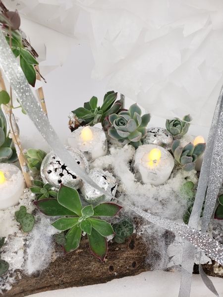 Silver leaf on candles for a Christmas display