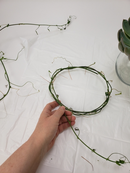 Start by weaving a wreath with the vine