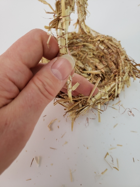 Use a bamboo skewer to wiggle open a guide hole for the handle