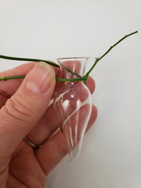 Wrap a jasmine vine around the neck of a tiny glass seahorse vase