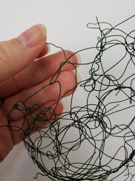 Add in more wire tangles and stich then together with wire to craft a flat base