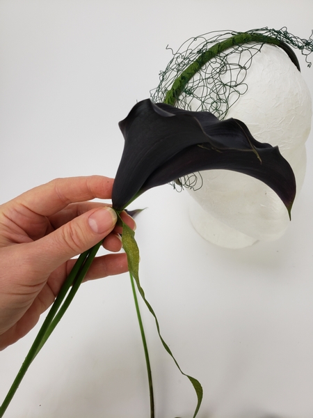 Tape the lilies into the position you want