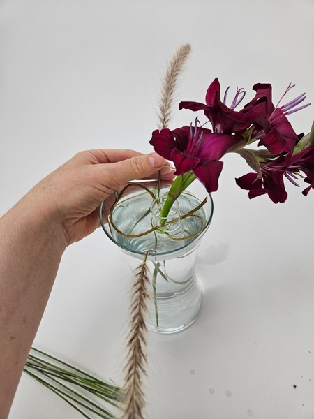 Add another fluffy fountain grass on the opposite side.