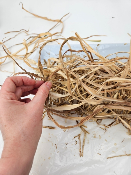 Cover the entire wire shape with upright foliage