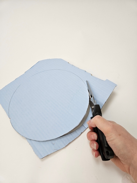 Cut the cardboard shape out with sturdy scissors