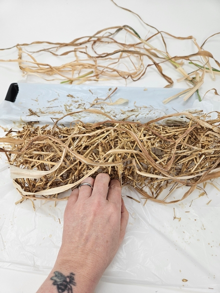 I am gluing these ribbons of foliage into position every here