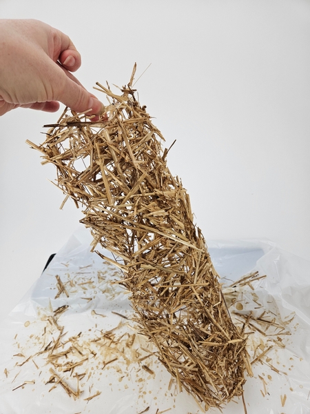 Test the mesh shape to see if all the straw is secured