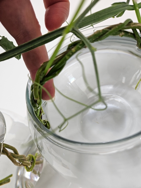 And hook the pansy stems behind the braid to minimize clutter in the vase.