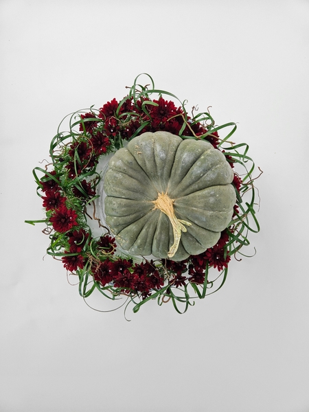 How to display a heavy pumpkin in a floral design so that it can be used again