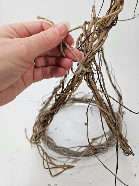 Knot the other side to secure the wreaths into a basket handle