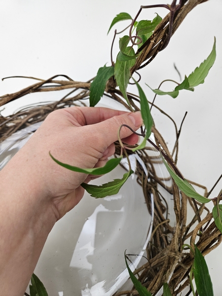 Simply weave stems in and around and all over the basket to green it up a bit