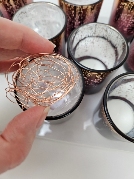 Slip the disk into the lined glass containers