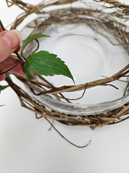 Slip vines through the wreath