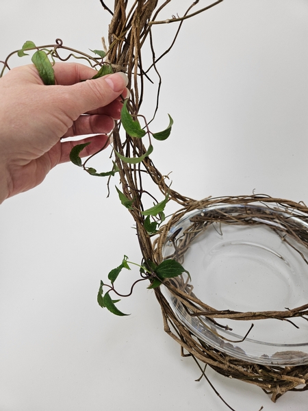 Weave the rest of the vine over and around the wreath basket