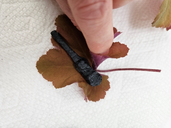 Glue a wrapped corsage magnet to a coral bell leaf