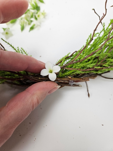 Glue the flowers directly into the design using floral glue