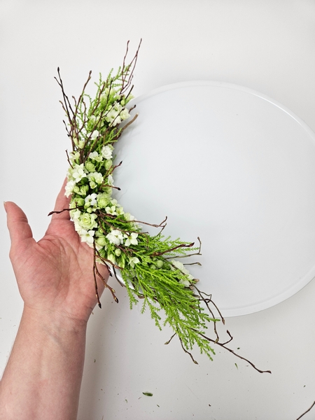 Place the flowers on a cake stand.