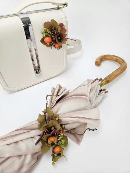 Using Boutstix magnets and a Wriststix strap to attach floral corsages to a parasol and handbag