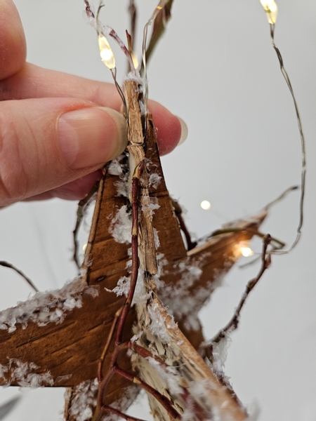 And slip the fairy light wire through the cut