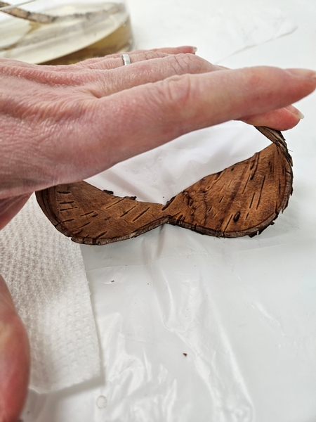 Carefully curve the sides towards the inside of the bark