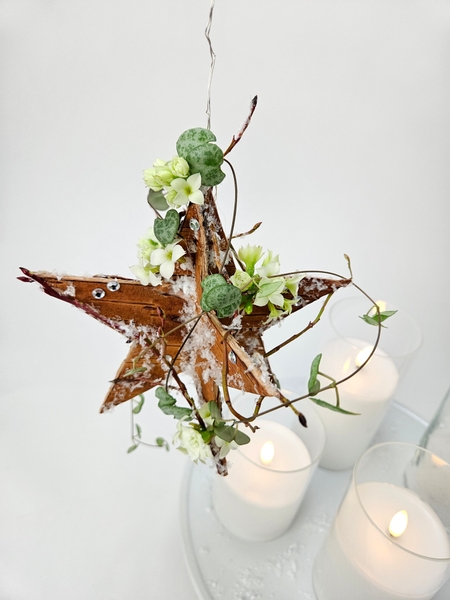 Cut a star out of birch bark for a fresh floral mobile design