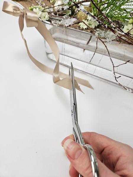 Cut the ribbon ends neatly with sharp ribbon scissors