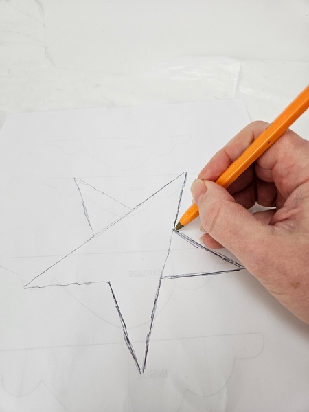 Draw a star on paper to use as a template