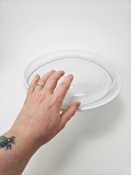 Measure out a low glass container to fit on a cake stand