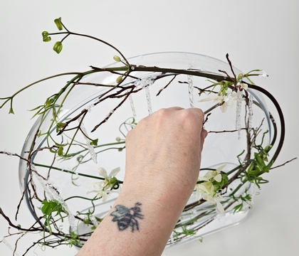 Straight up and down icicle, clematis vine and huckleberry twig double vase winter display