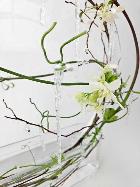 Armandii clematis in a winter themed floral arrangement