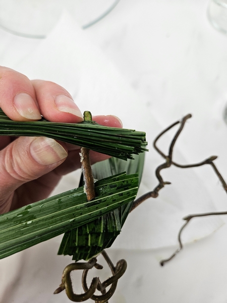 Remove the bamboo skewer and replace it with the snow covered hazel twig