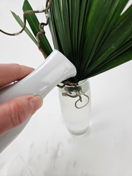 Top up the water in the display vase so that all the cut ends are below water and can remain hydrated