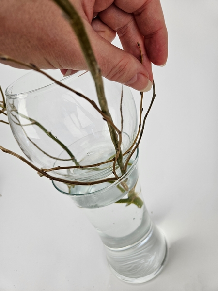 Gently twirl the willow stems around this top container