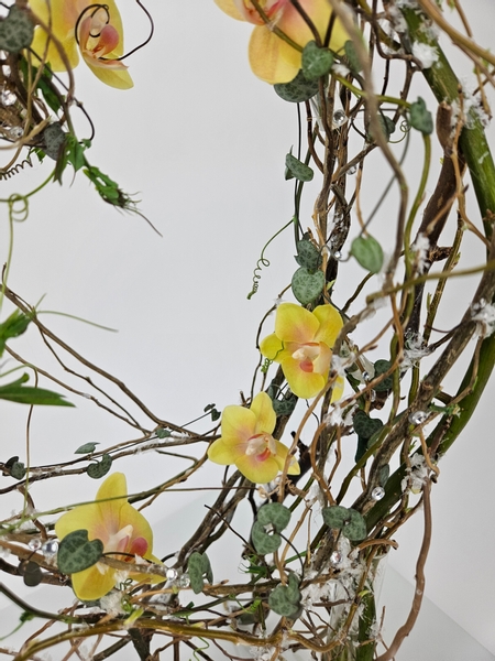 Phalaenopsis orchids in a floral art design using home made water tubes