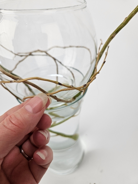 Securing each branch with the smallest drop of glue as you go along