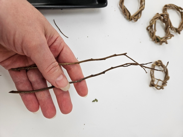 Use two thin dried twigs to connect the wreaths