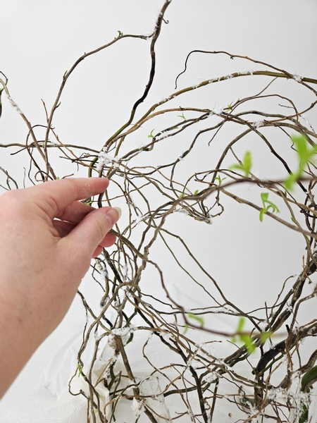 Weave the beautiful green willow stems through the armature