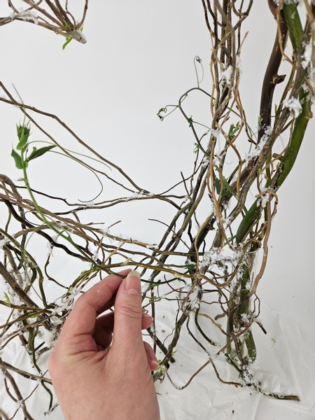 Weave the vine through the armature with one side branch to the front