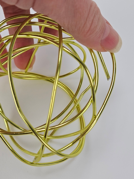 Tuck all the sharp wire ends into the ball